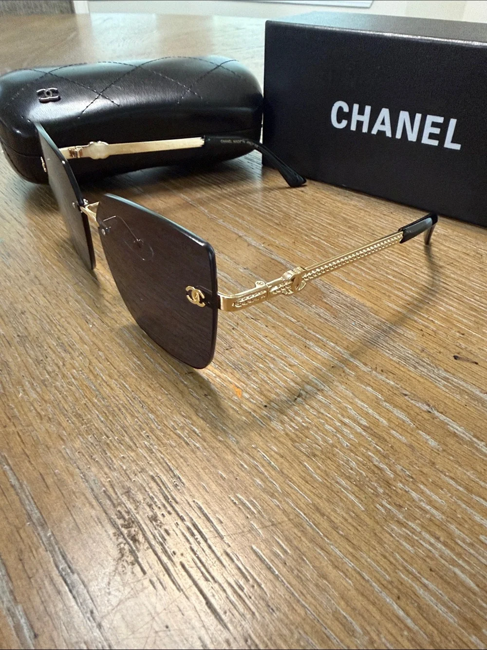 CHANEL Rimless Square Sunglasses with Dark Gradient Lenses and Gold Accents